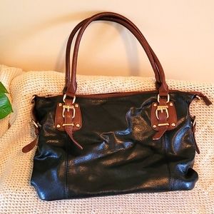 Black and tan shoulder bag, gold buckles, zipper top with inside pockets